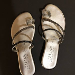 Silver colored sandals.